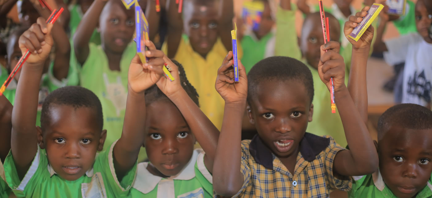 Giving out scholastic materials to Kiwawu Modern students1
