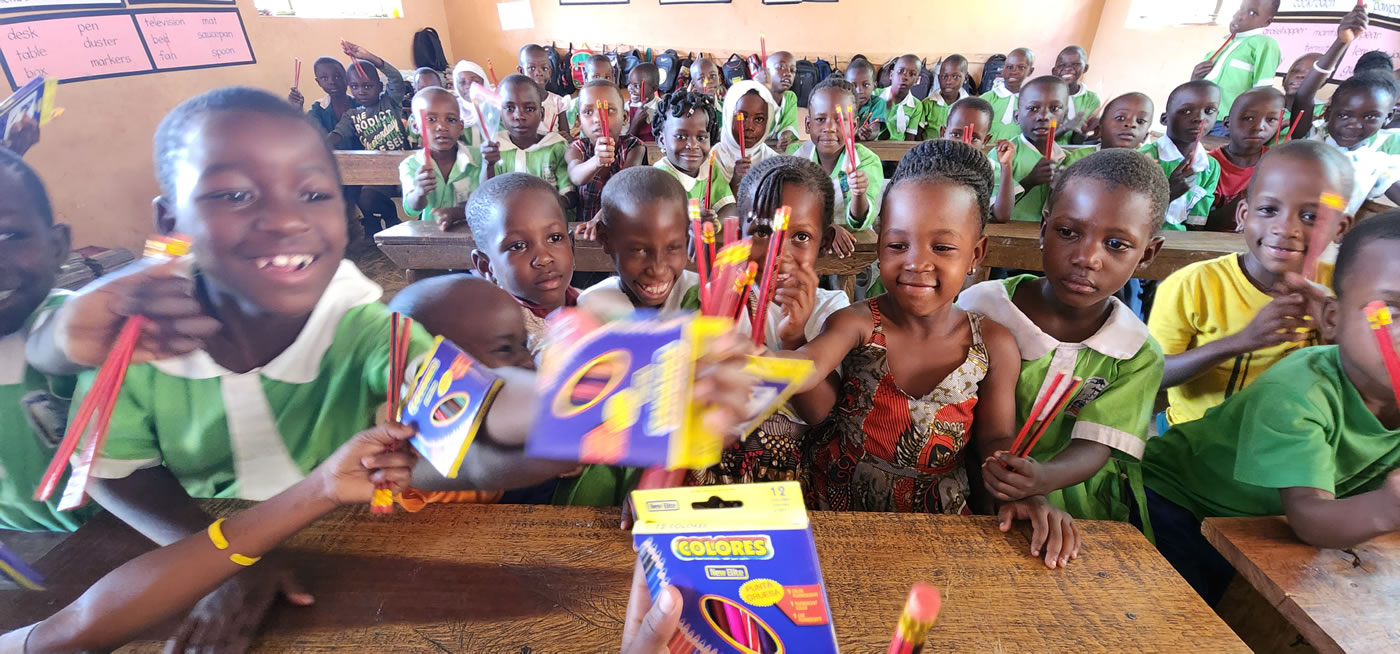 Giving out scholastic materials to kiwawu modern students